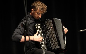 a man playing the accordion