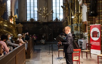 Man speaks into the microphone