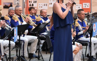 woman singing into the microphone