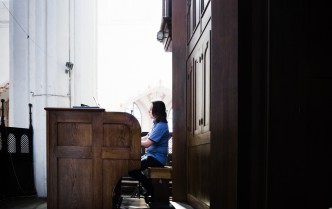 the man plays the piano