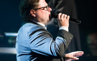 a man singing into the microphone