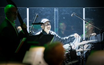 a man playing a drum kit