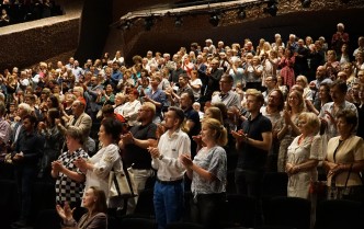 Cheering audience at the end of the performance