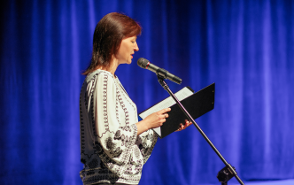 Woman reading from a page