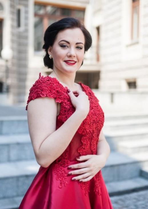 young brunette woman in red dress