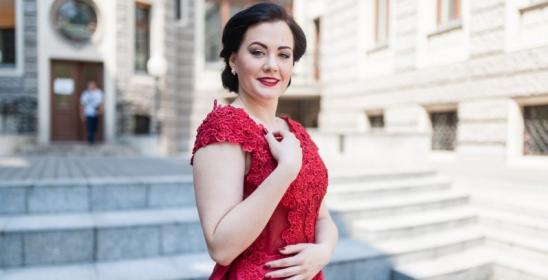 young brunette woman in red dress