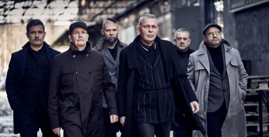 six men in dark costumes